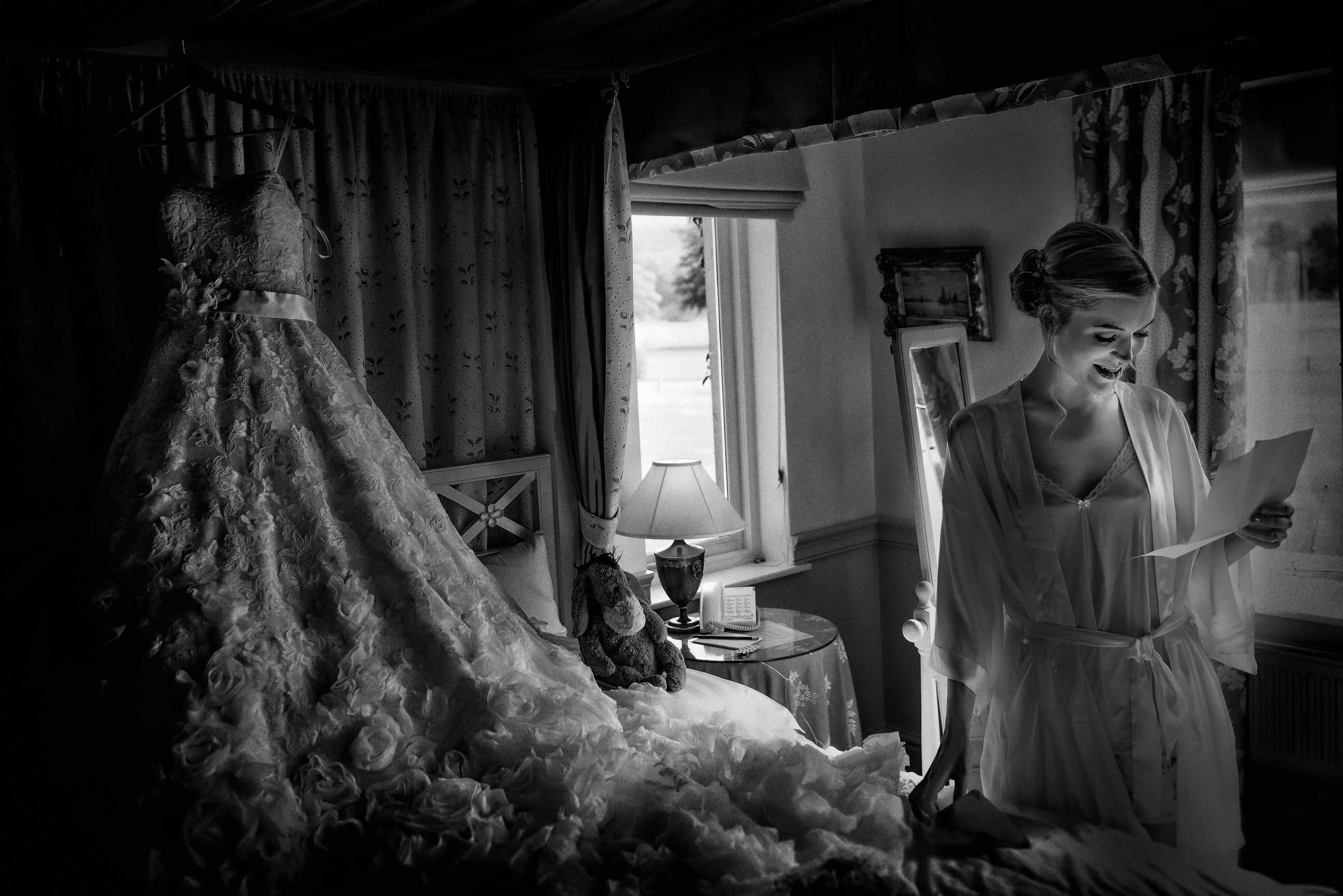 Lancashire wedding photograph of a bride reading a love letter