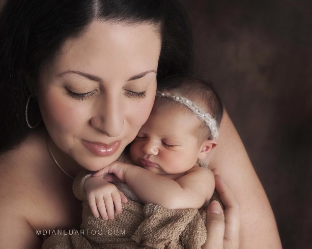 Gorgeous newborn baby with mama photo