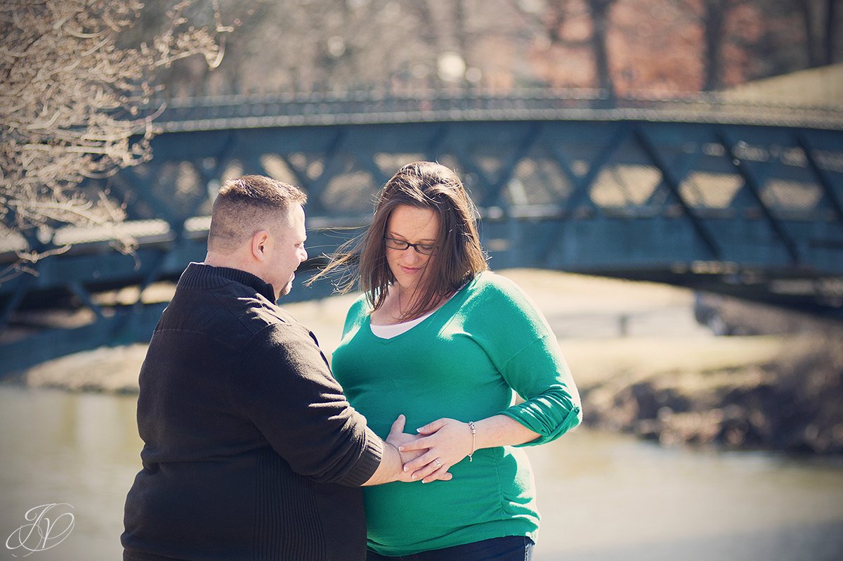 father to be touching stomache, expecting parents in washington park, expecting mother and chocolate lab, maternity session washington park, maternity and pet portraits in washington park albany, albany maternity photographer, albany maternity photos
