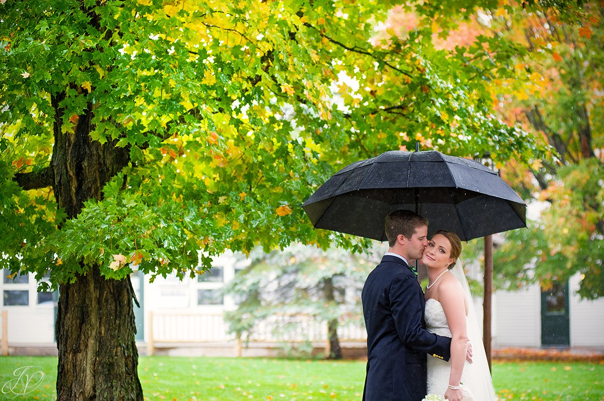 romantic photo of bride and groom on rainy wedding day