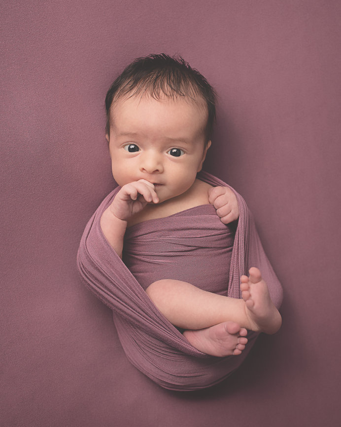 How do I pick a newborn photographer?