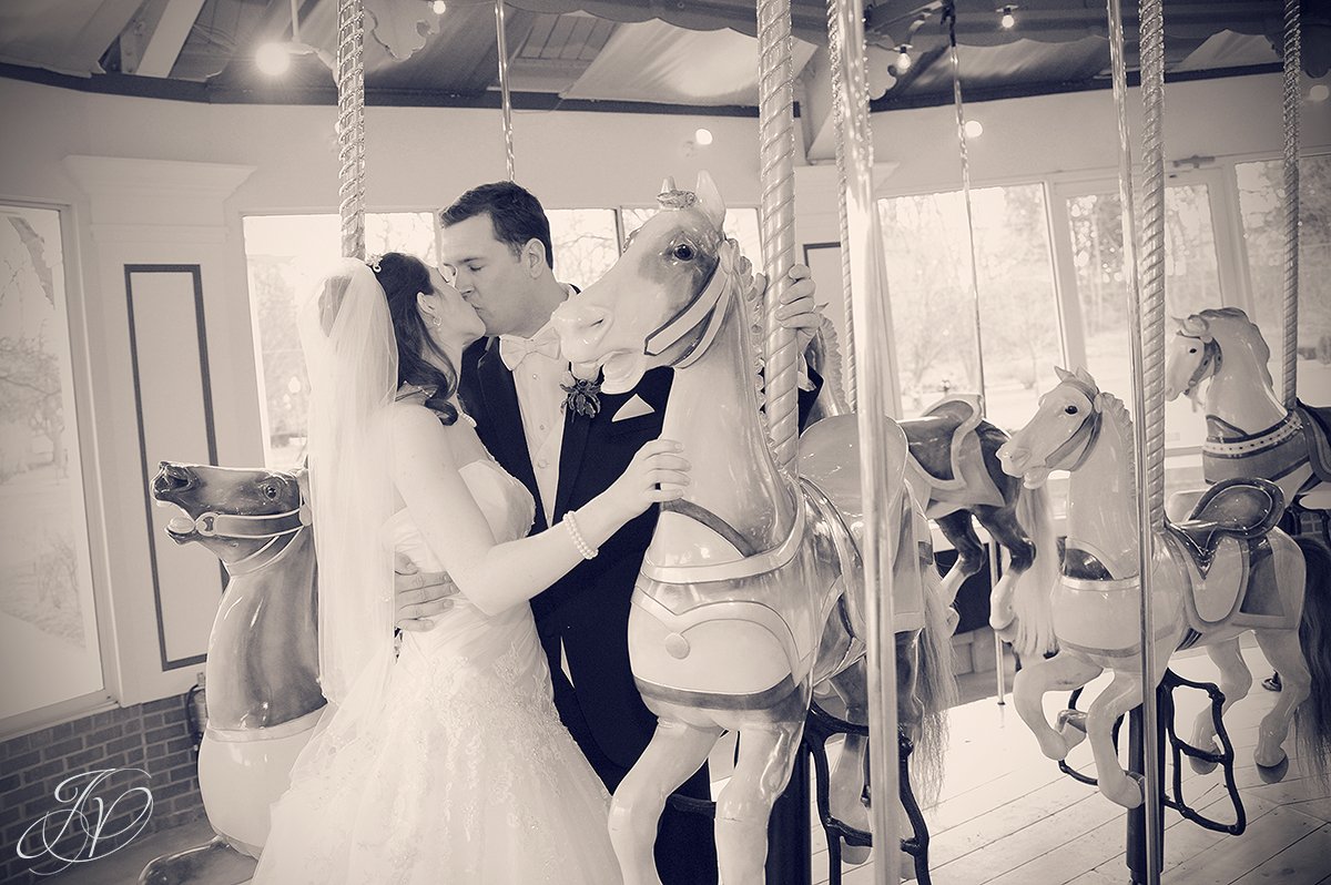 bride and groom on carousel photo, bride and groom with hoarse photo, Saratoga Wedding Photographer, The Canfield Casino wedding, the carousel in congress park