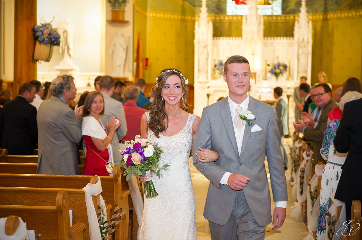 bride and groom exiting church ceremony