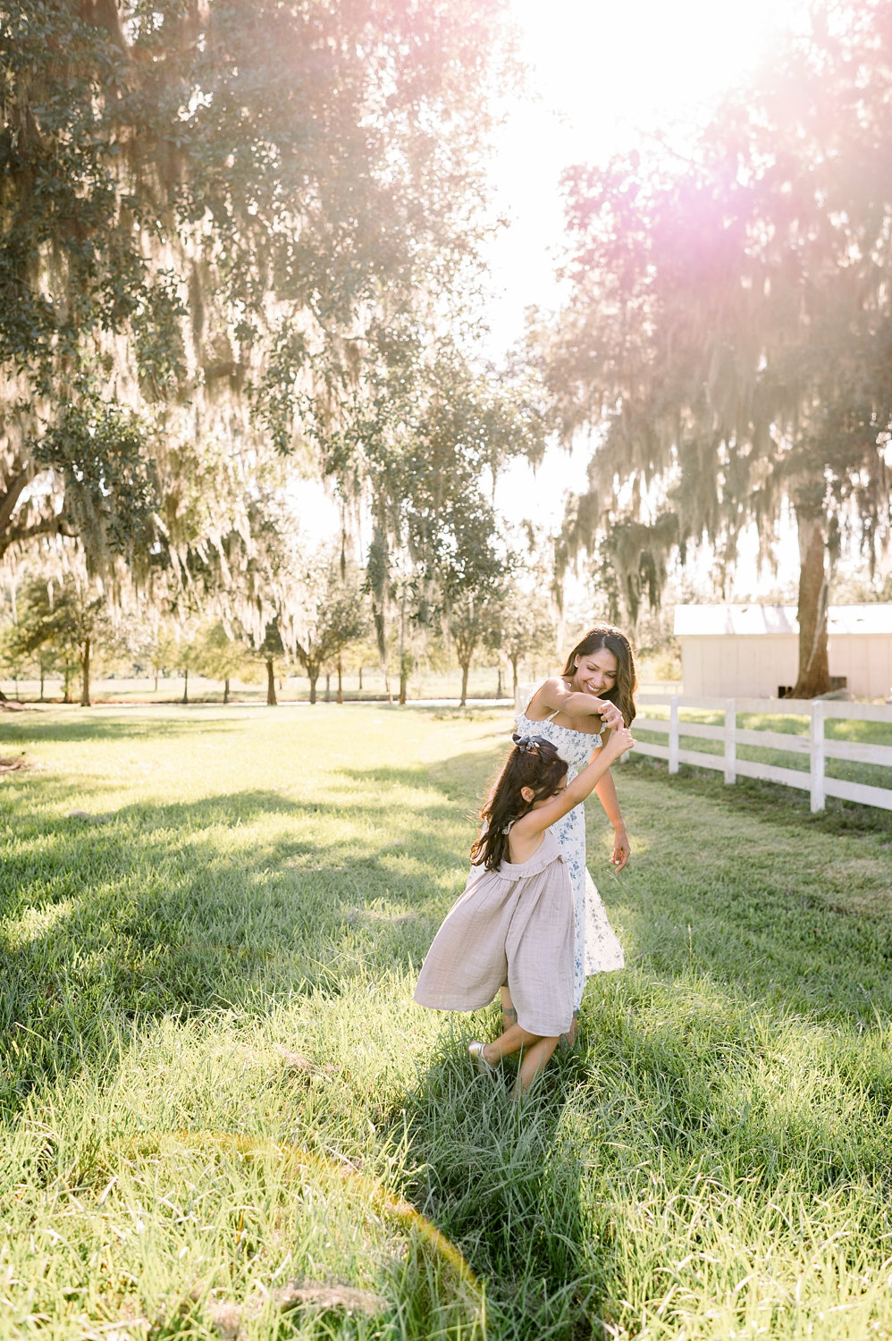 light and airy portrait, mother and daughter twirling, Congaree and Penn, Rya Duncklee