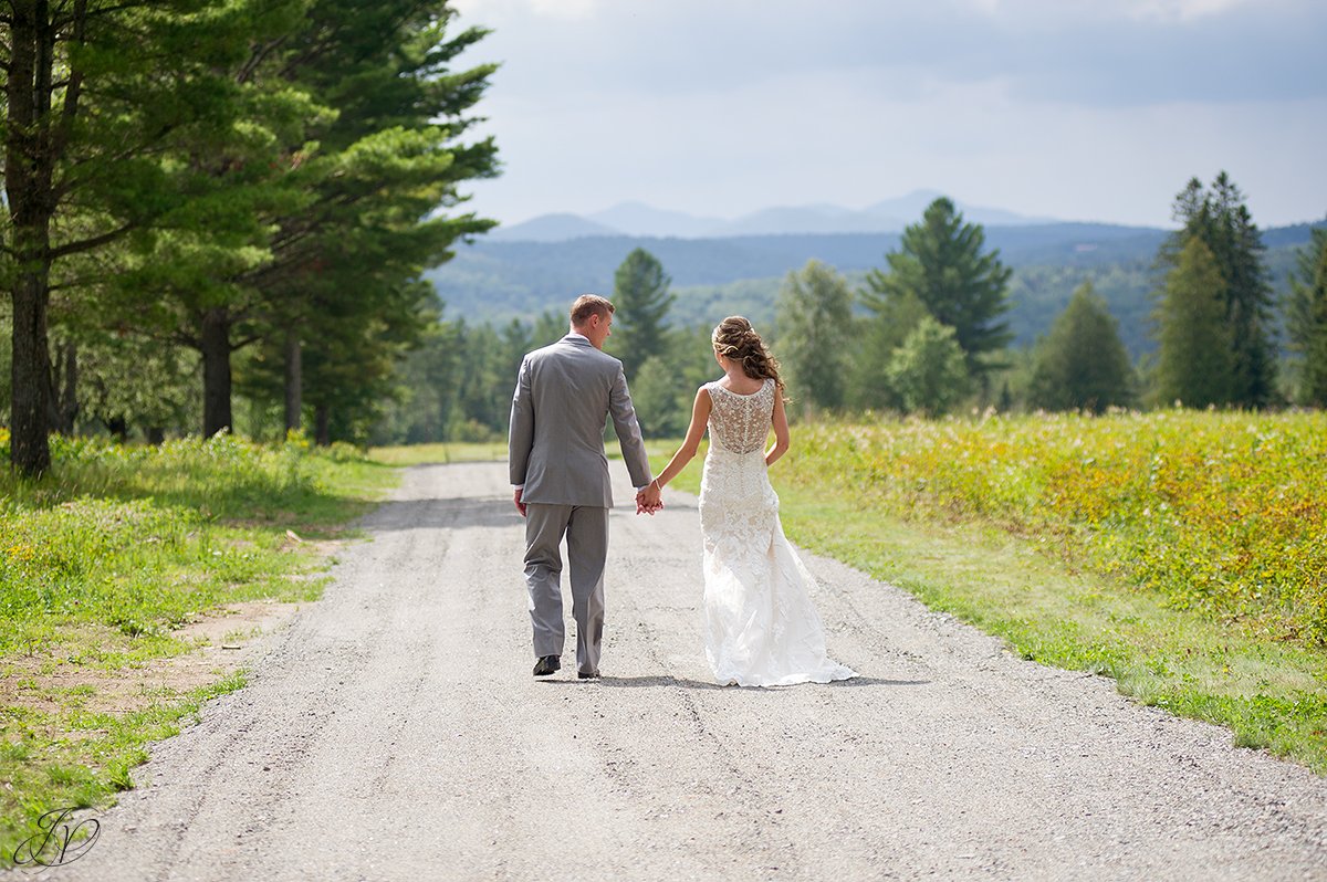 bridal and groom walking outside in front of mountain