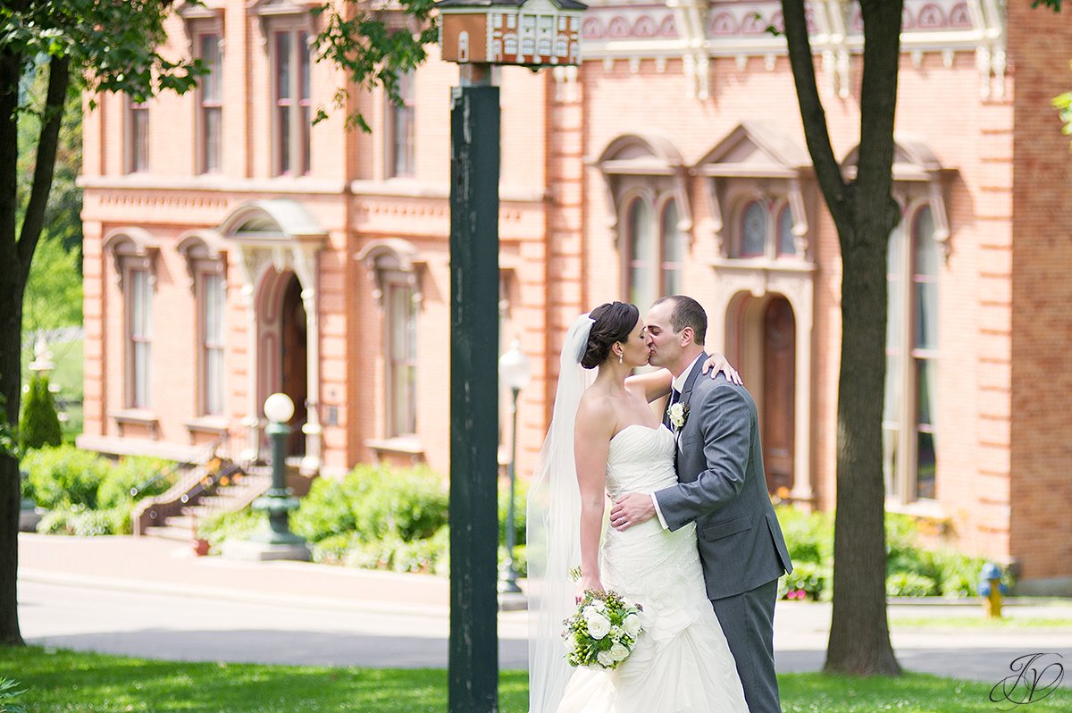 bride and groom photo in congress park with view of canfield casino saratoga springs