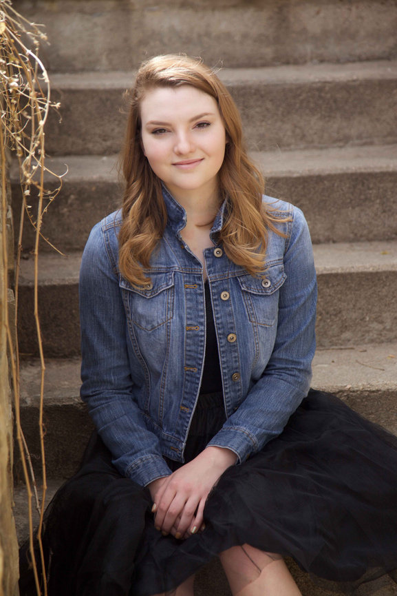 High school senior in a custom Colorado-inspired studio session, posing confidently in natural light. Portrait reflects personal identity and timeless sophistication. Luxury senior photography serving Colorado’s discerning families.