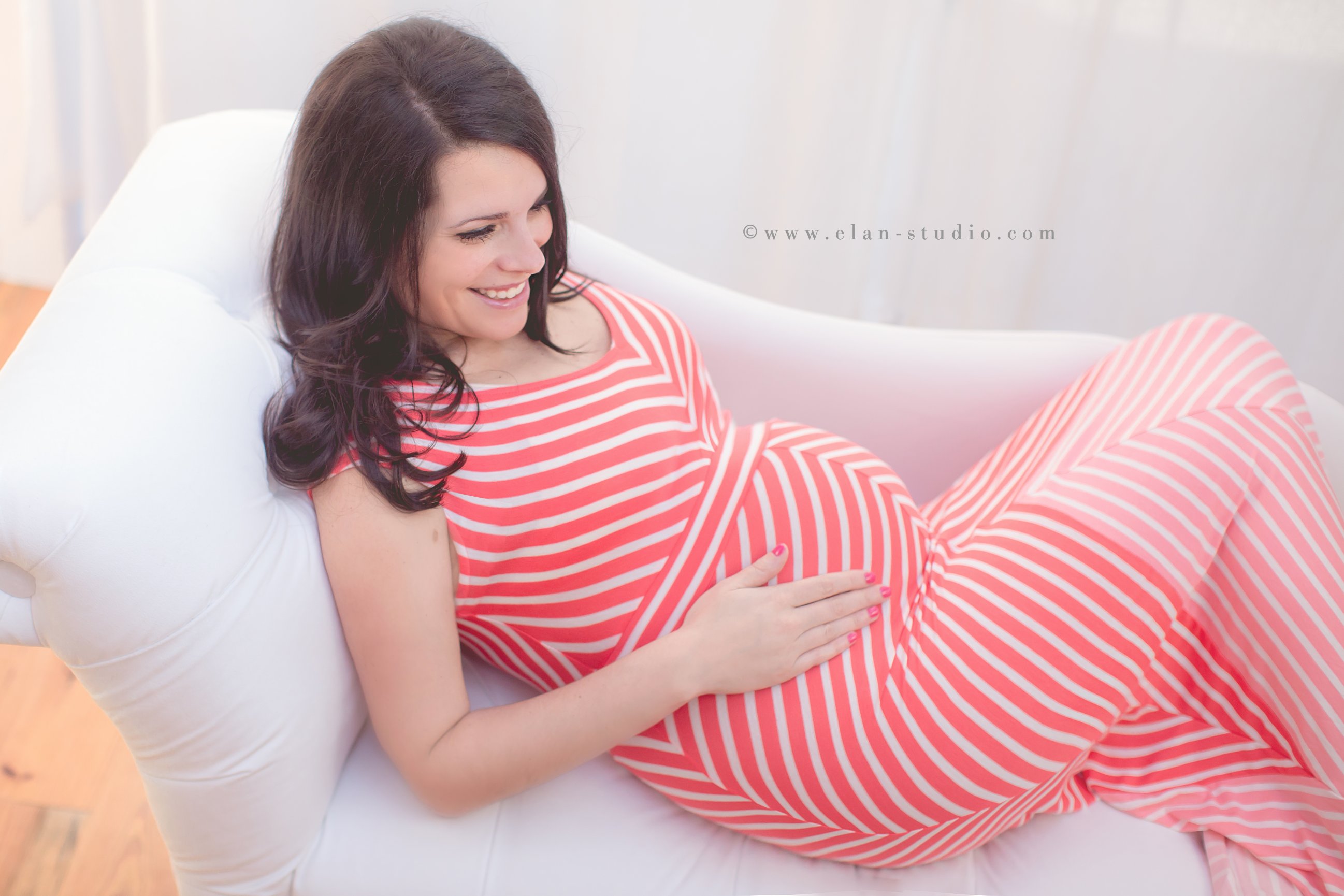pregnant woman with dark hair, coral striped maternity dress, Elan Studio