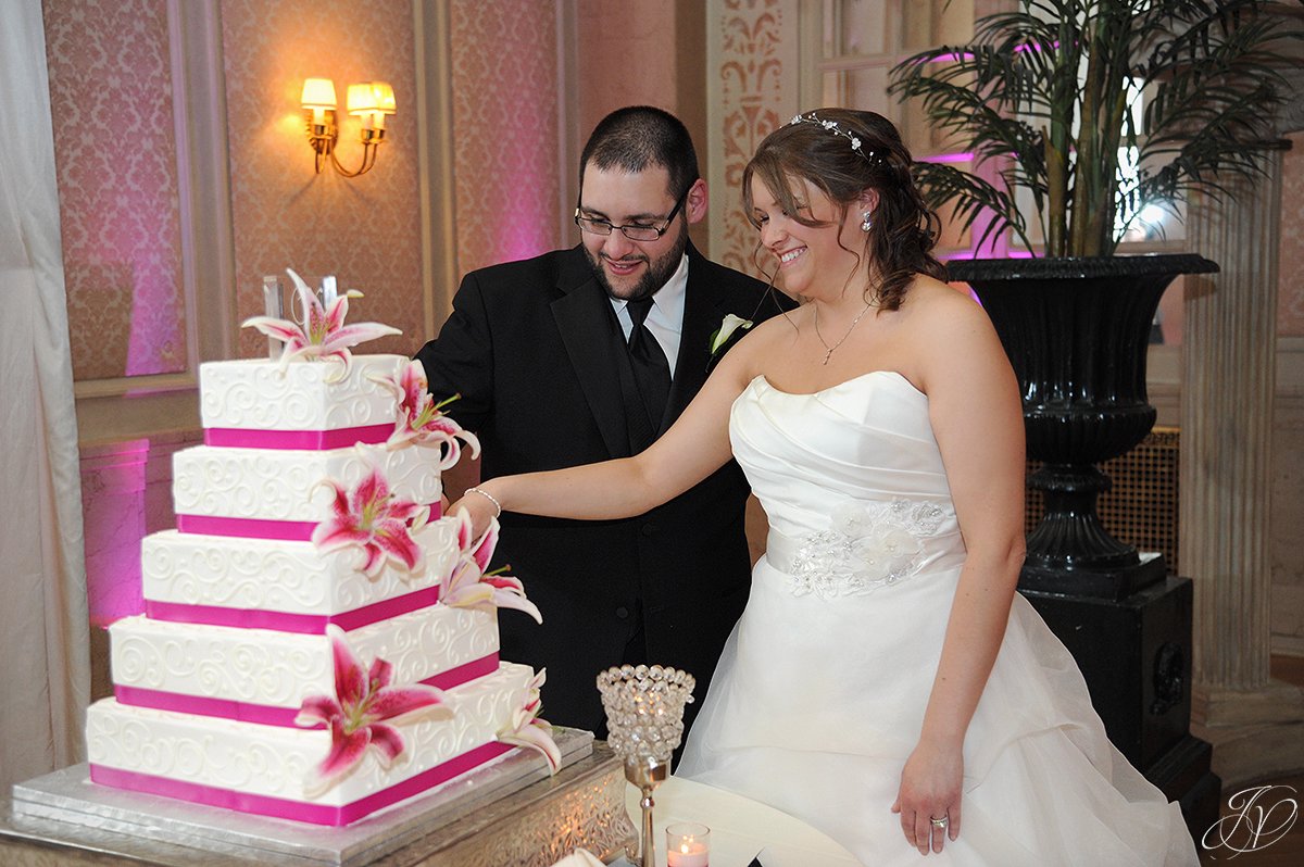 bride and groom cake cutting photo