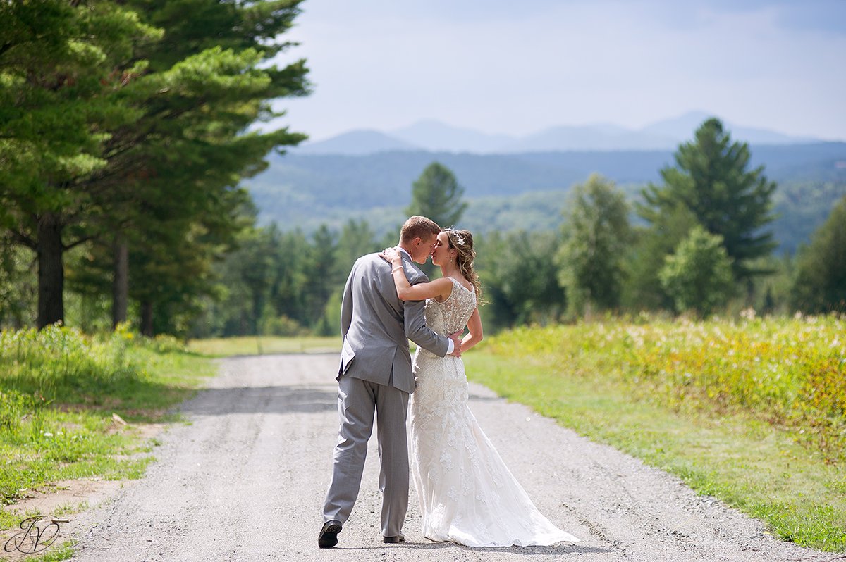bride and groom almost kissing lake placid nature