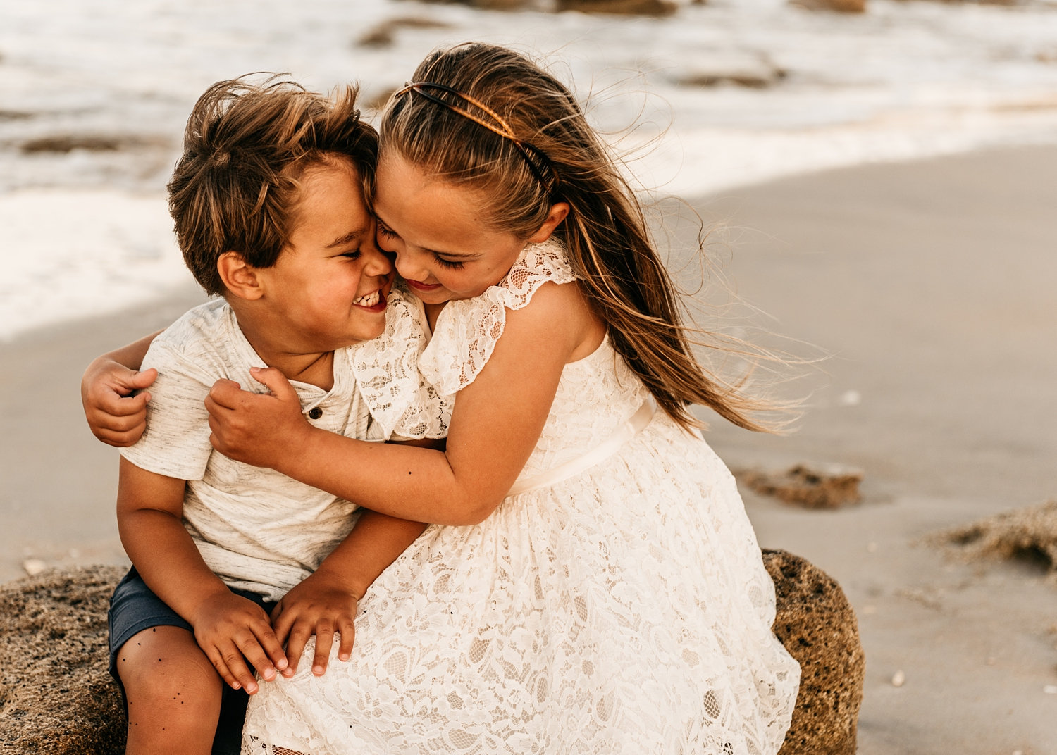 little girl hugging her little brother on the beach, Saint Augustine Beach, Florida