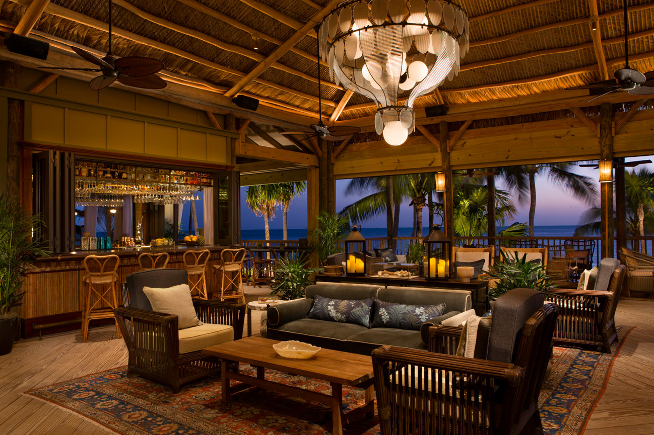 Tom Sawyer Style Lobby with Bar beautifully decorated with more modern style furniture surrounded by the Gulf of Mexico Ocean.