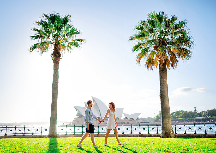 Couple walking in a park during a Sydney Opera House Photoshoot with Sarah Iris Photography.