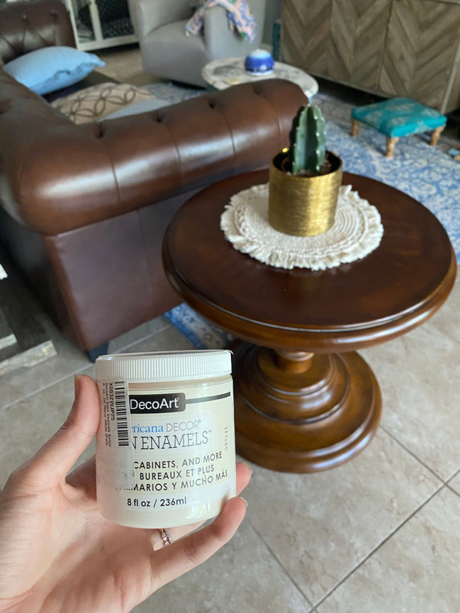 before image of hand painting a wood table with americana decor satin enamels paint