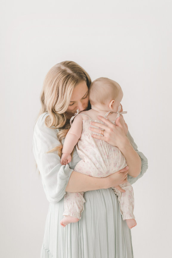 Mother holding her baby in a Minneapolis studio setting