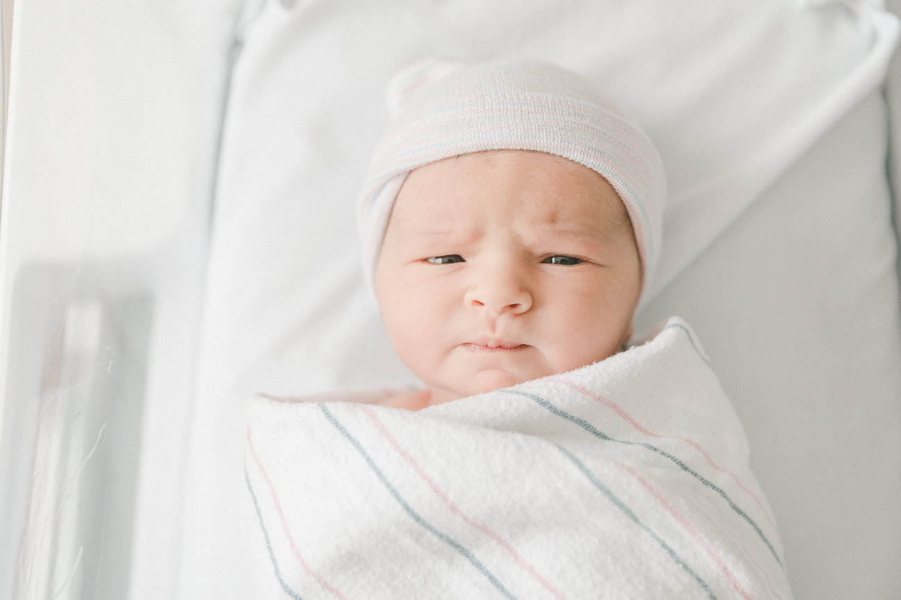grumpy face baby in hospital