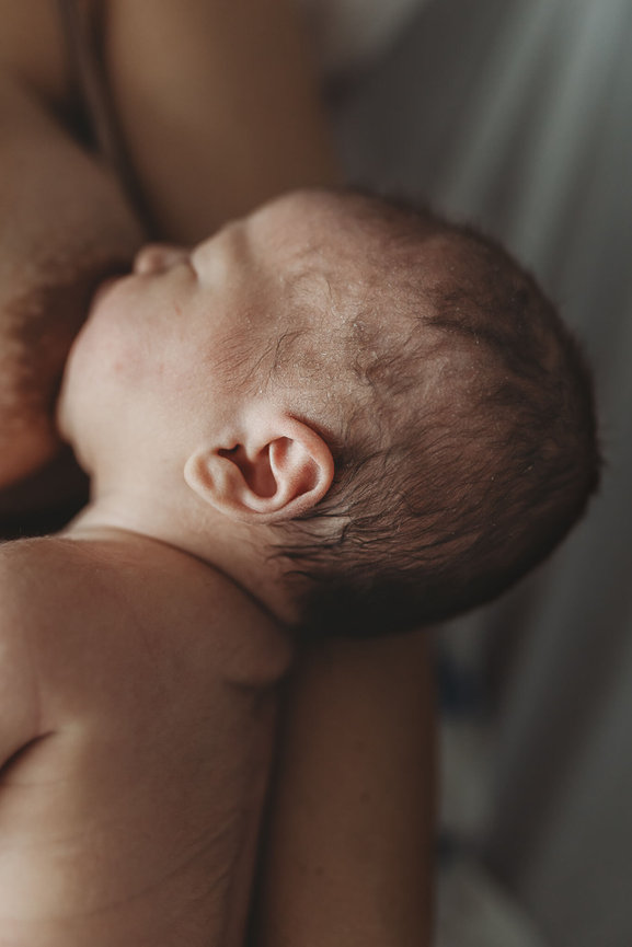 A newborn baby's tiny ear captured by New Jersey Newborn Photographer. Love of James Photography.