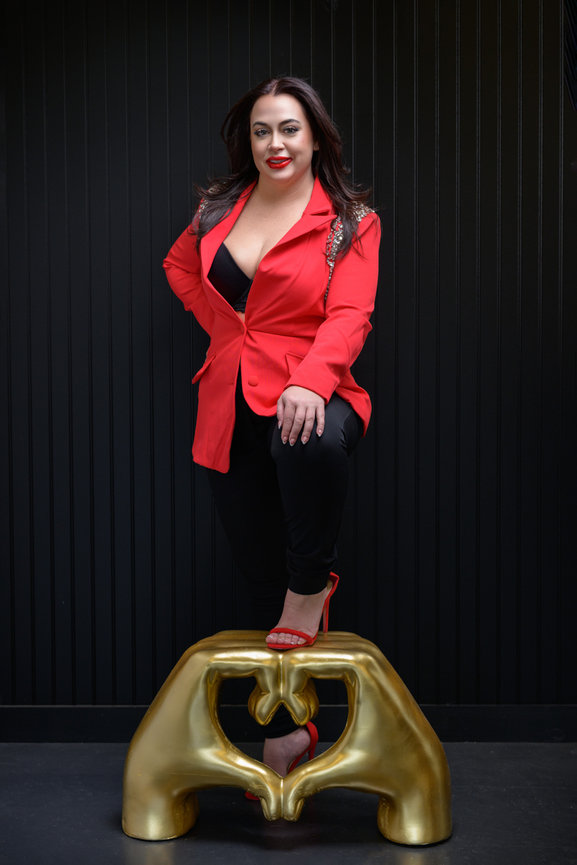 Professional women's portrait photography Orlando - woman in red embellished blazer seated on gold stool, She's More Than by Karen K Photo