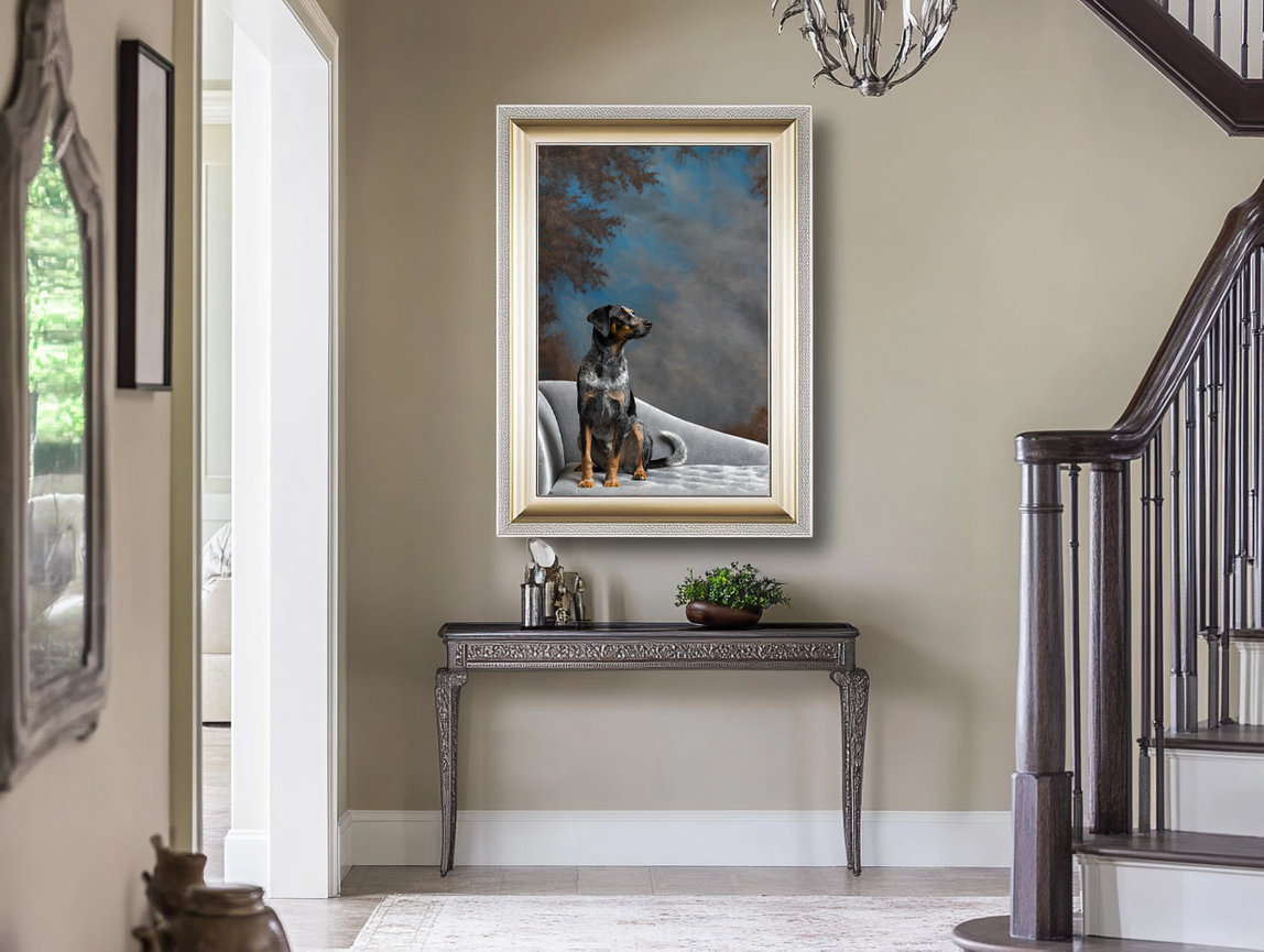 Framed portrait of a Bluetick Coonhound sitting on a white velvet chair, displayed in a refined foyer with neutral tones and a dark wood staircase.
