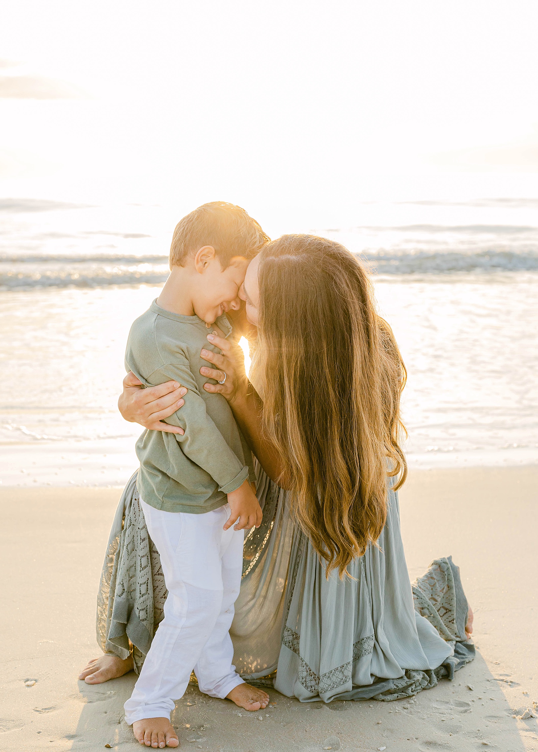 kids on beach at sunrise laughing