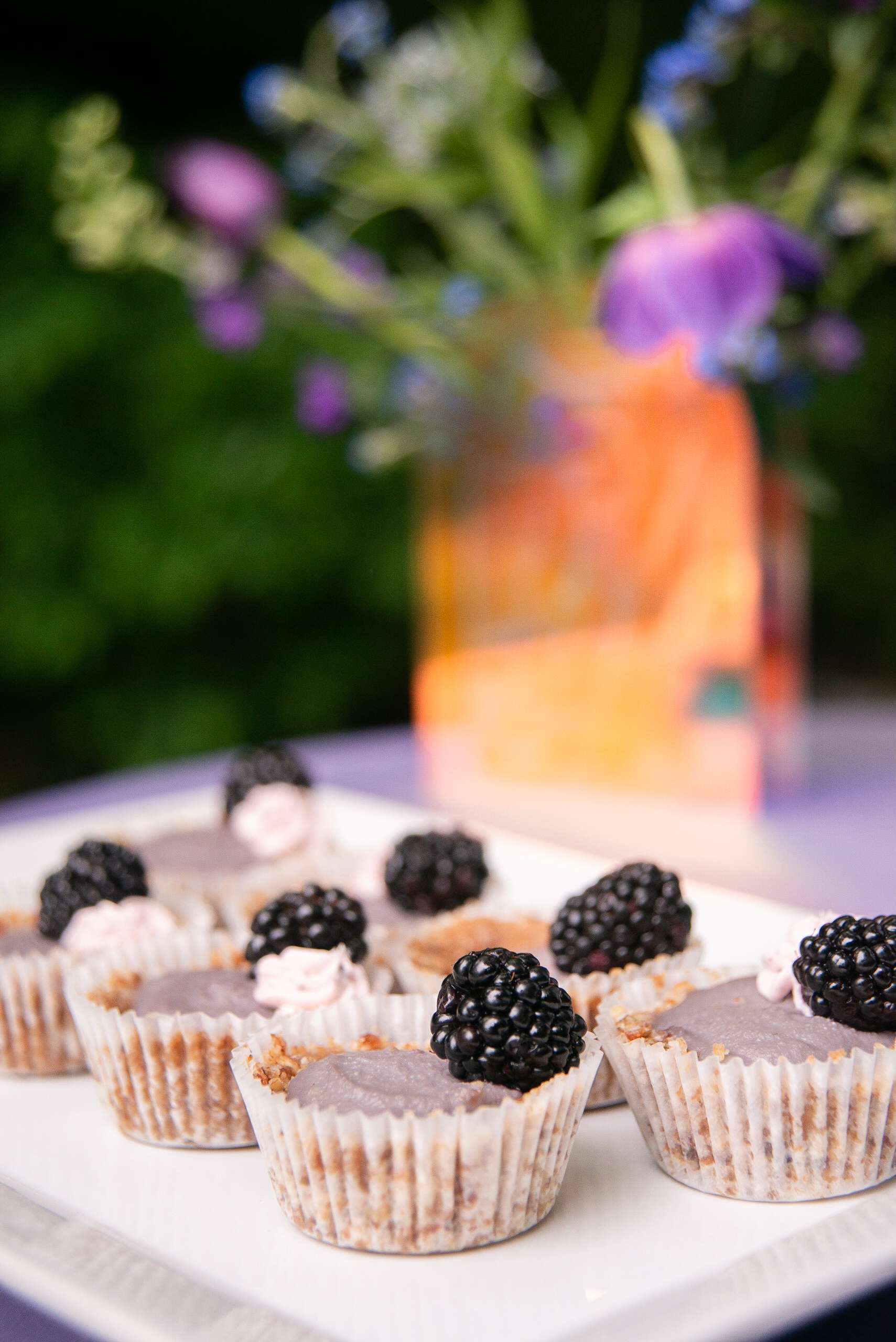 Blackberry cheesecakes being served at Enchanted Hills Wedding