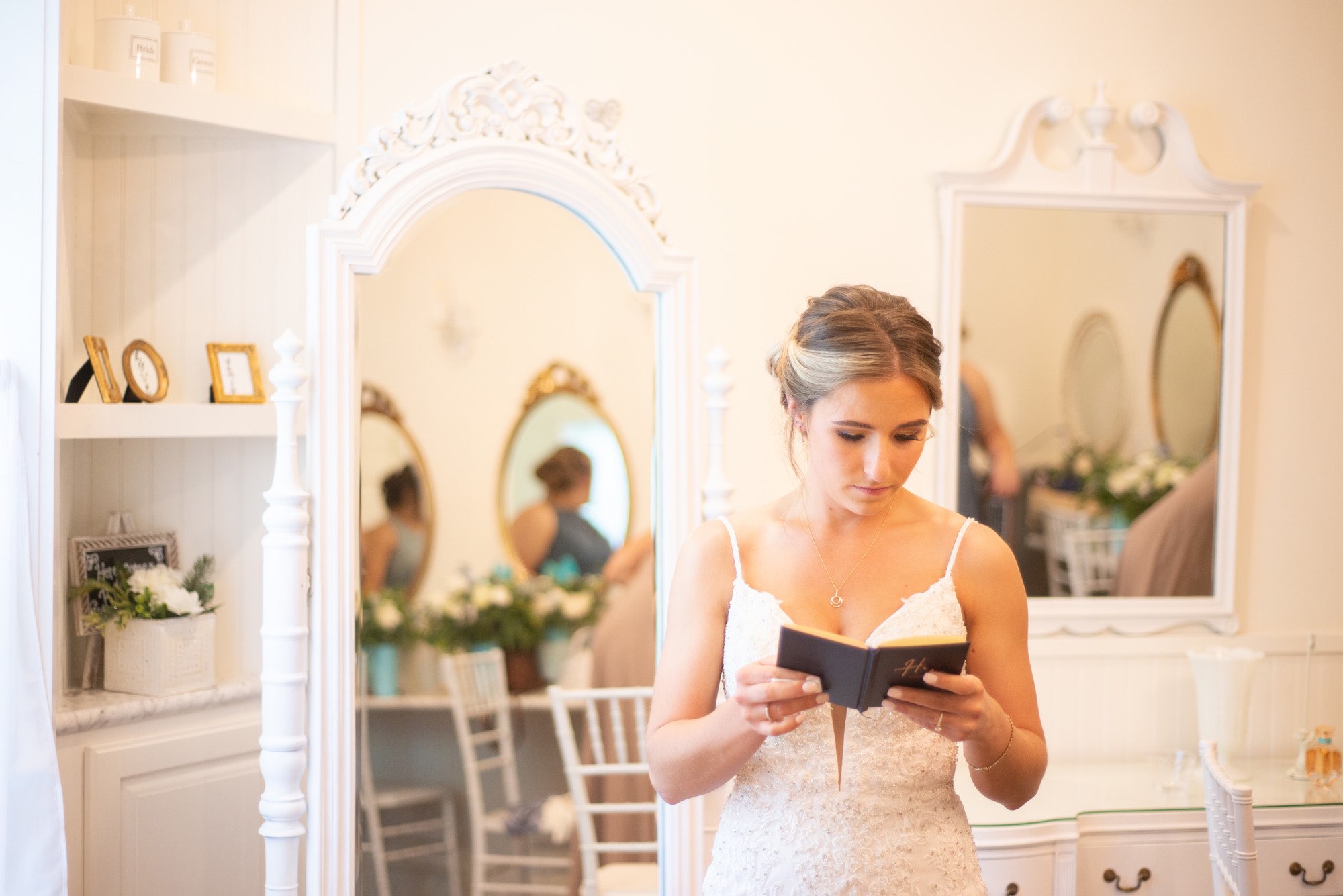 Bride reading a special message from her groom as she gets ready for the wedding.