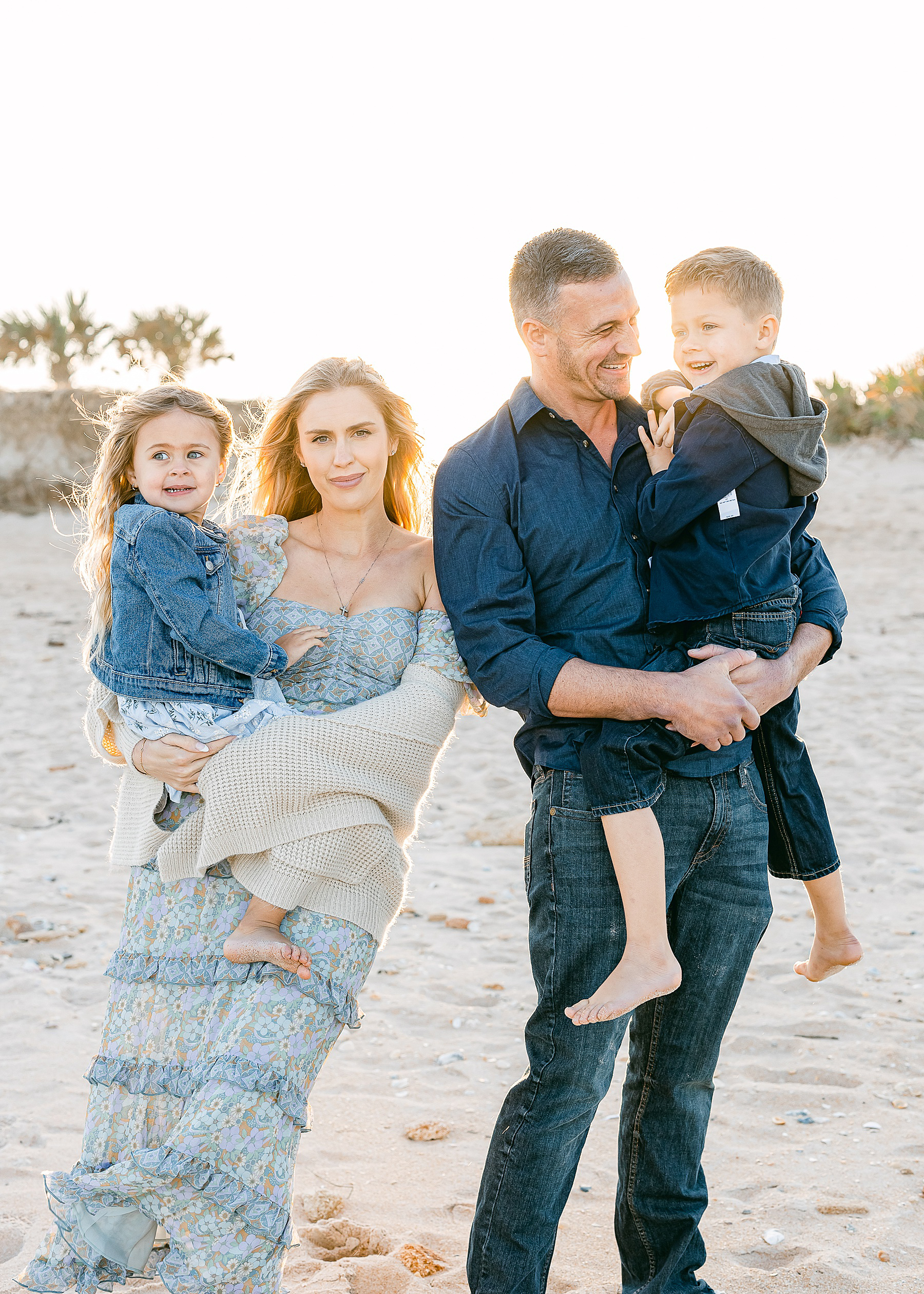 Ryan Lochte family standing on the beach at sunset 