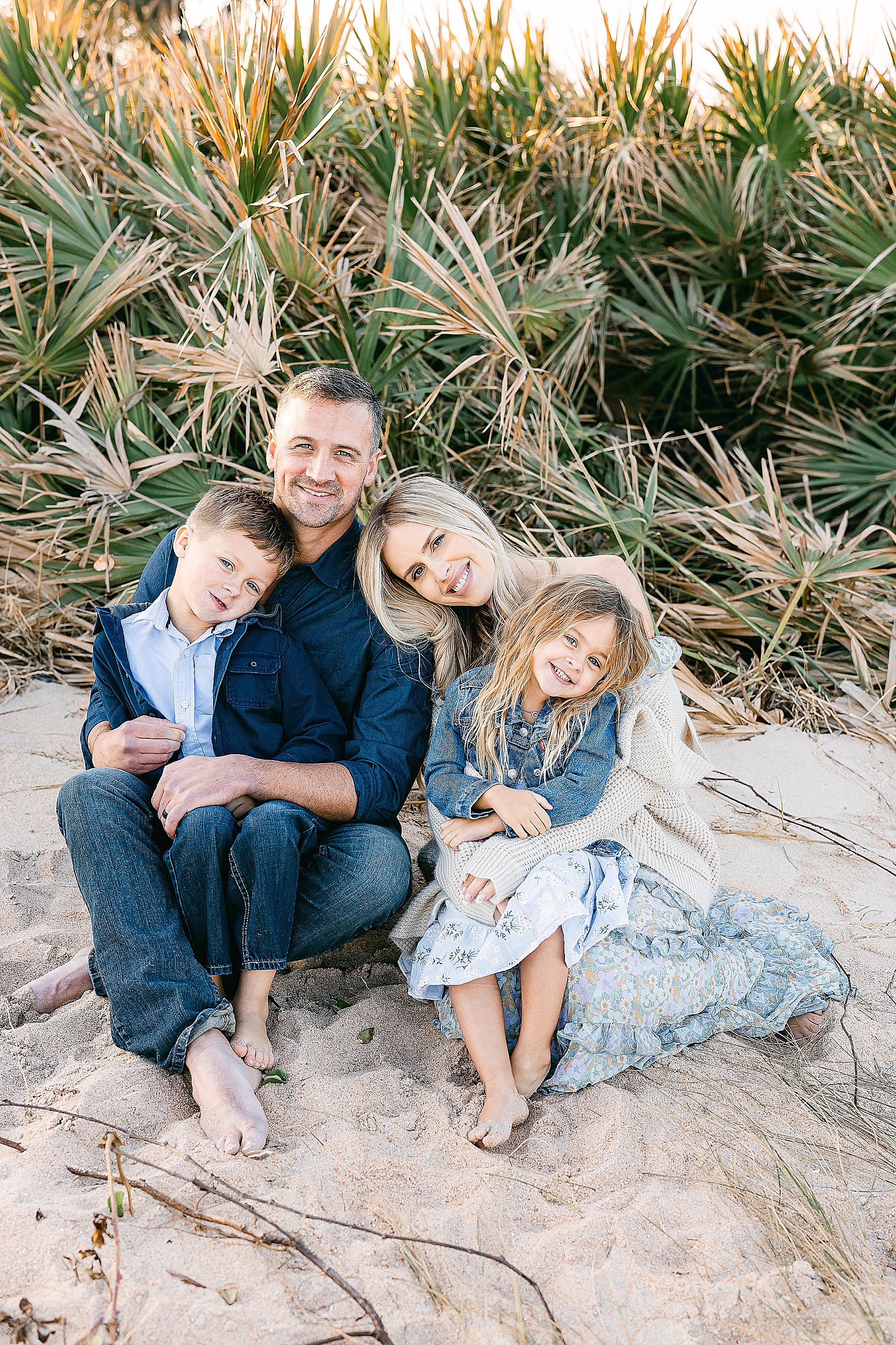 Ryan Lochte family sitting on the beach in Saint Augustine Florida
