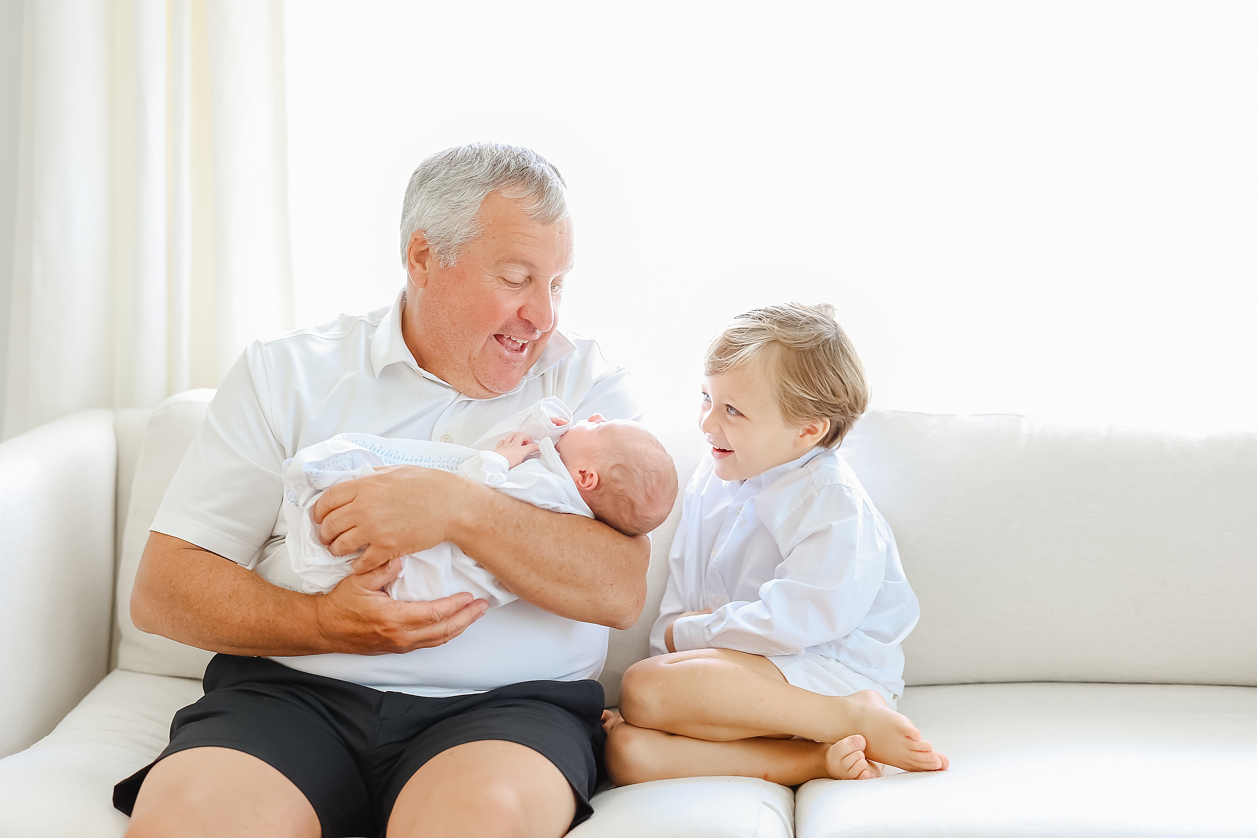 Newborn portrait of baby boy with his Grandfather.
