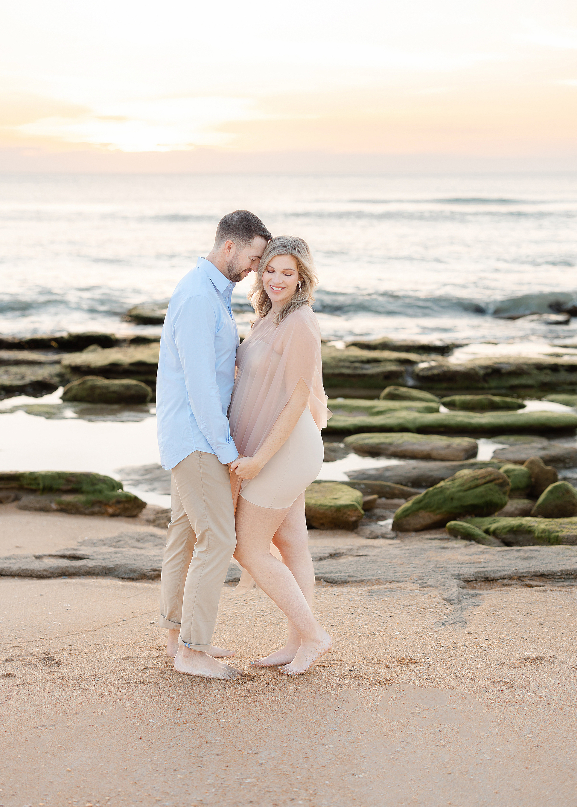 A coastal maternity portrait at sunrise in St. Augustine.