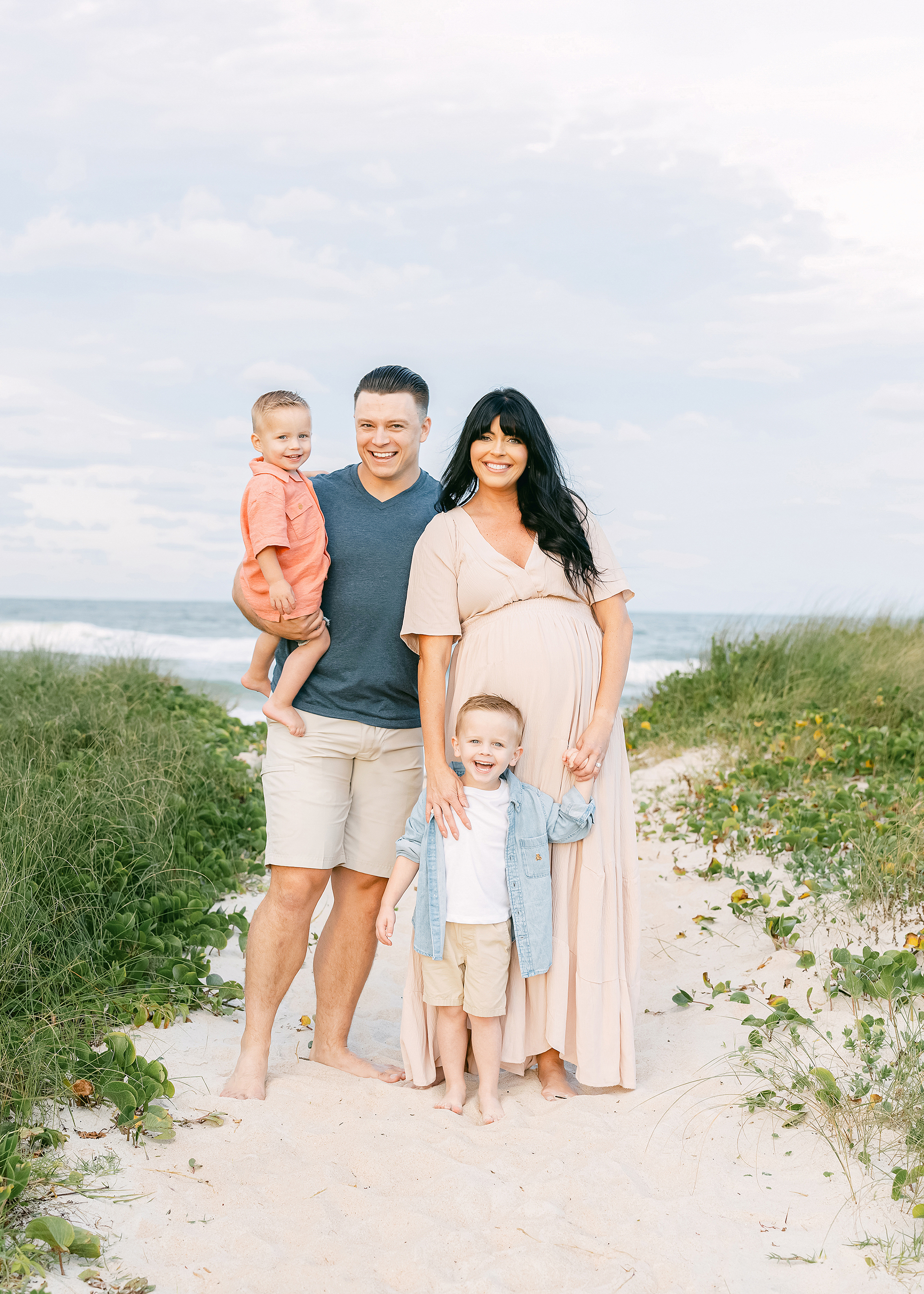 Airy sunset maternity portrait of a family on St. Augustine Beach.