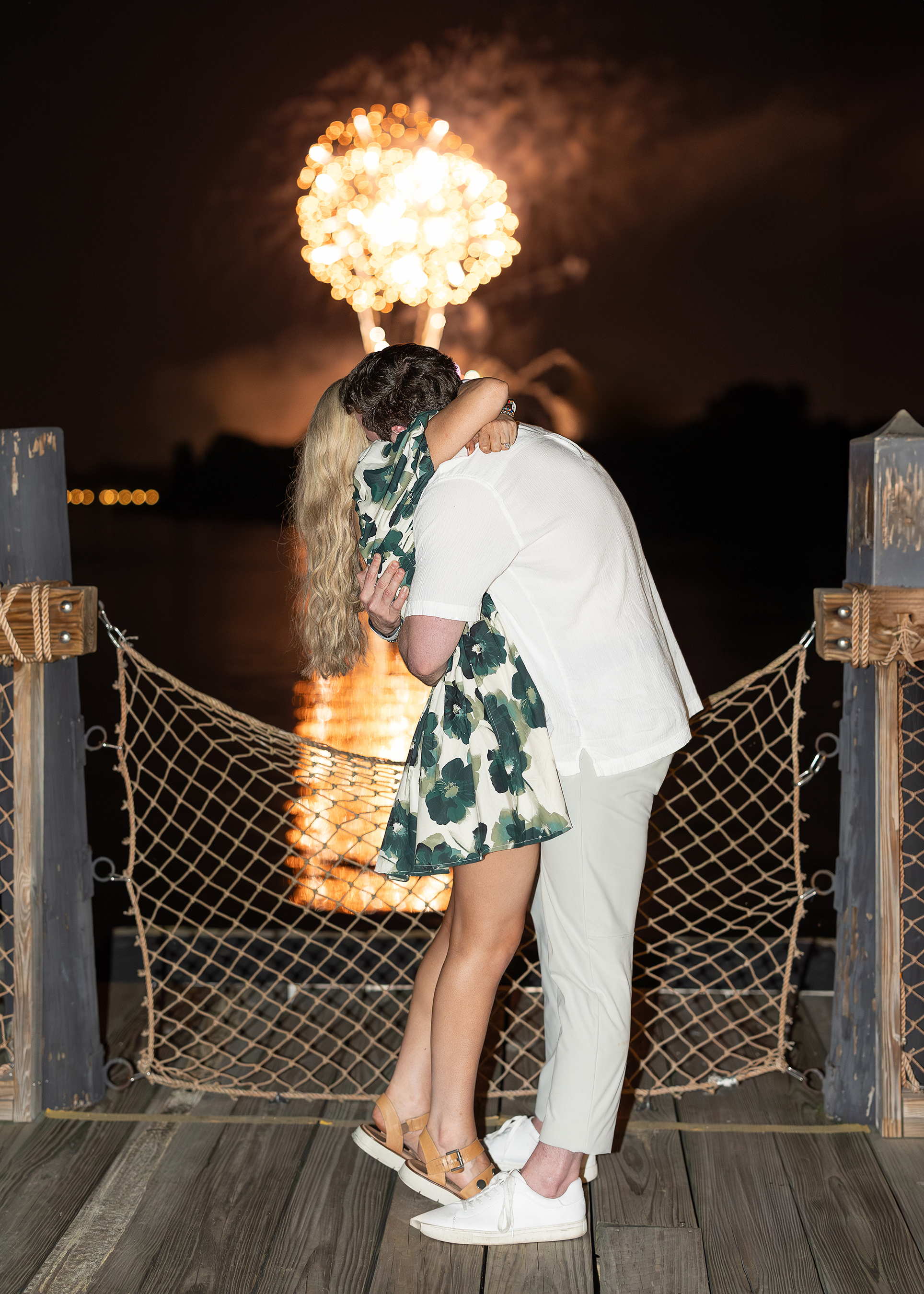 A surprise proposal during the happily ever after fireworks show at Disney's Polynesian Resort.