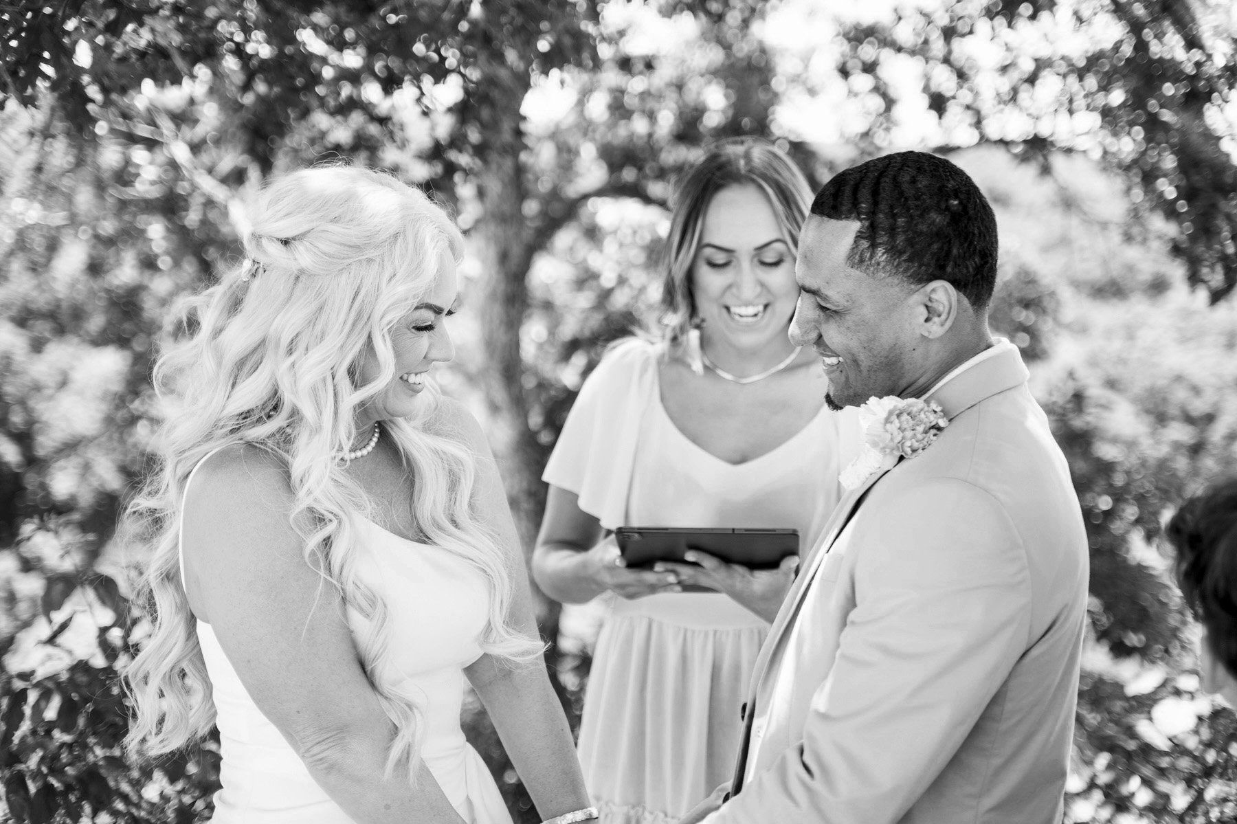 Bride and Groom laughing during their wedding