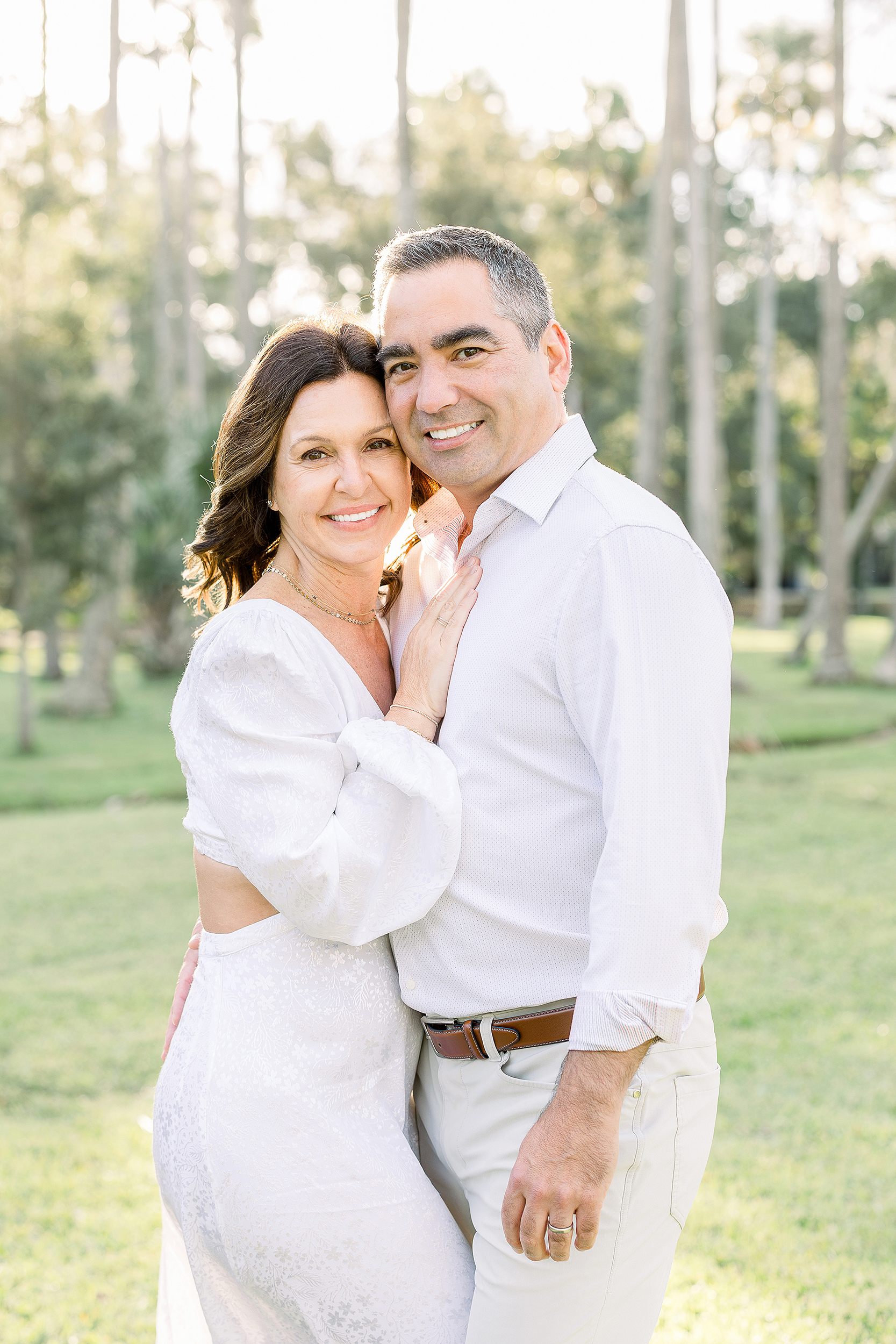 A light and airy portrait of a couple dressed in white in Johansen Park in Atlantic Beach, FL.