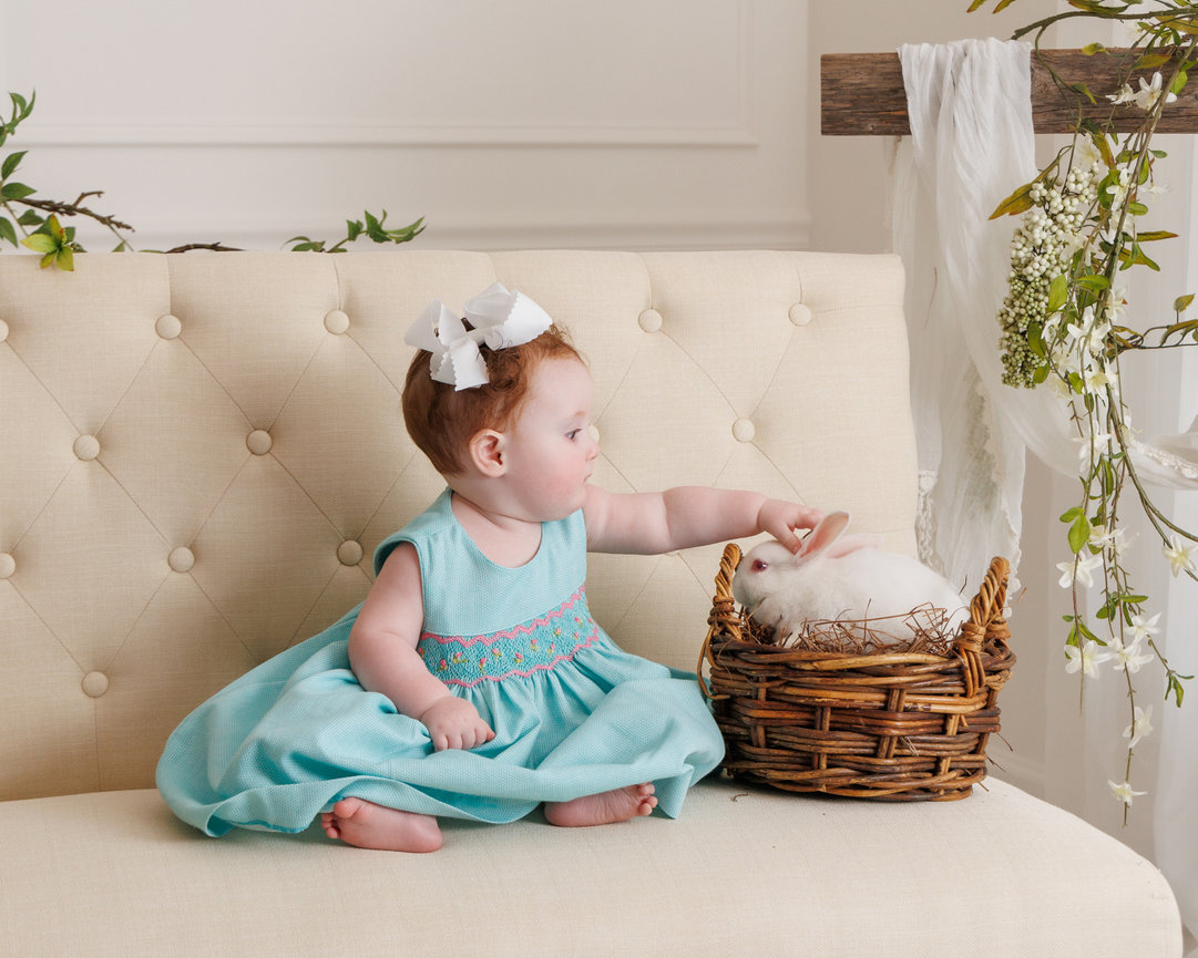 hild smiling during Easter Bunny photo session in Clarksville, Tennessee