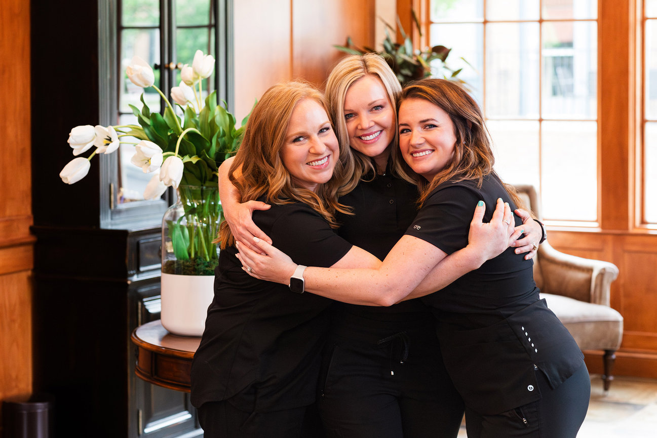 New Albany Smiles team embrace, branding photography New Albany Ohio