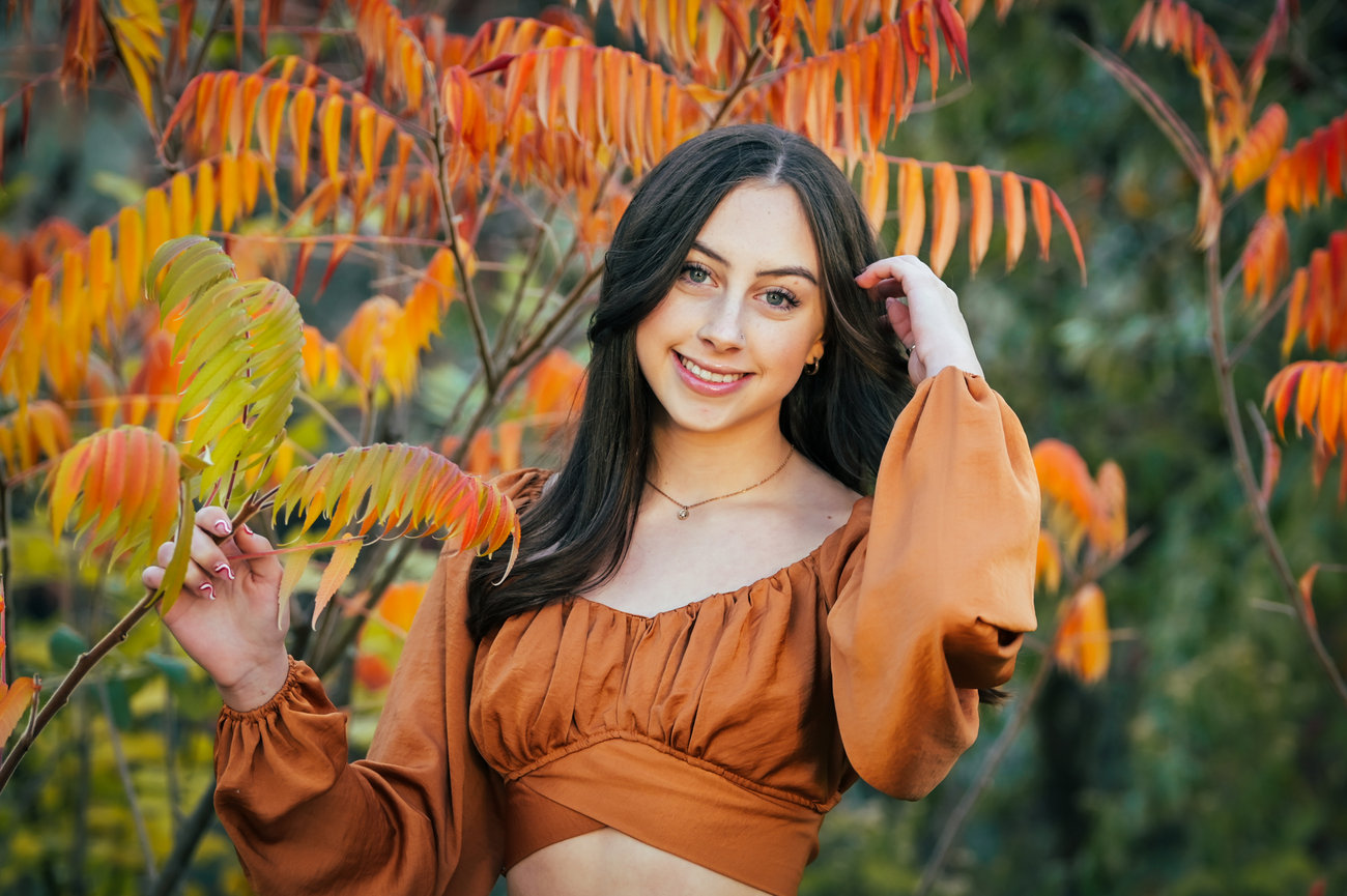 Senior year photos of girl in copper colors top with leaves that match. Boise, Idaho