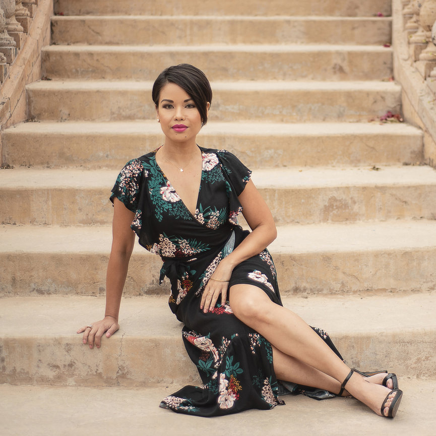 Powerful but feminine pose with young woman in dress sitting on stairs, by San Diego Personal Branding Photographer, Stefanie Blue.