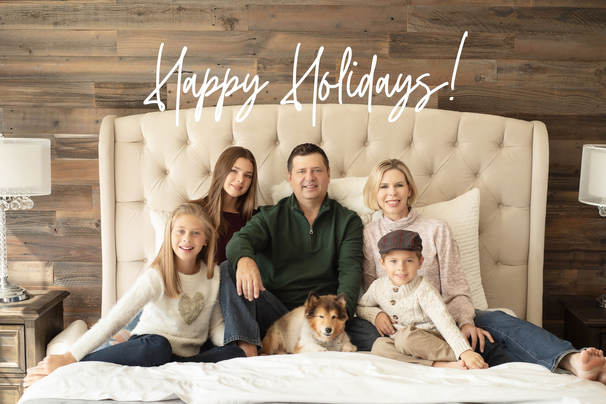 cute family holiday portrait sitting on bed