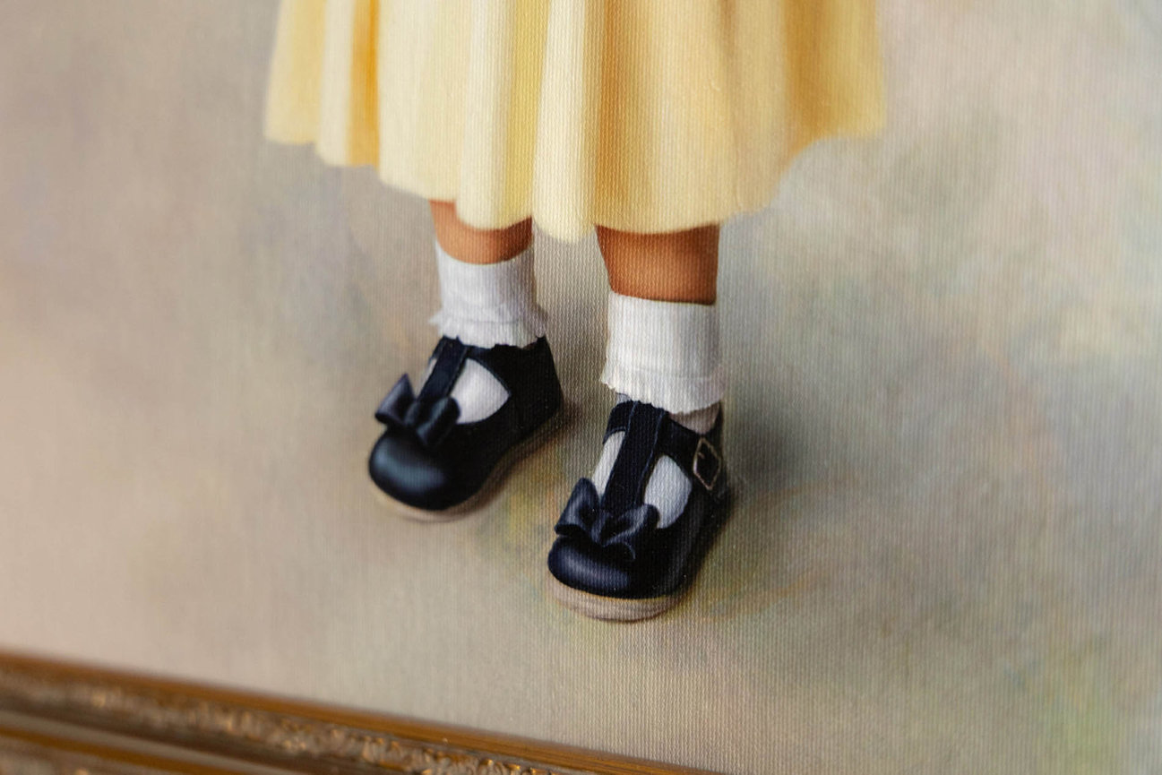 Traditional oil portrait of a child in timeless attire