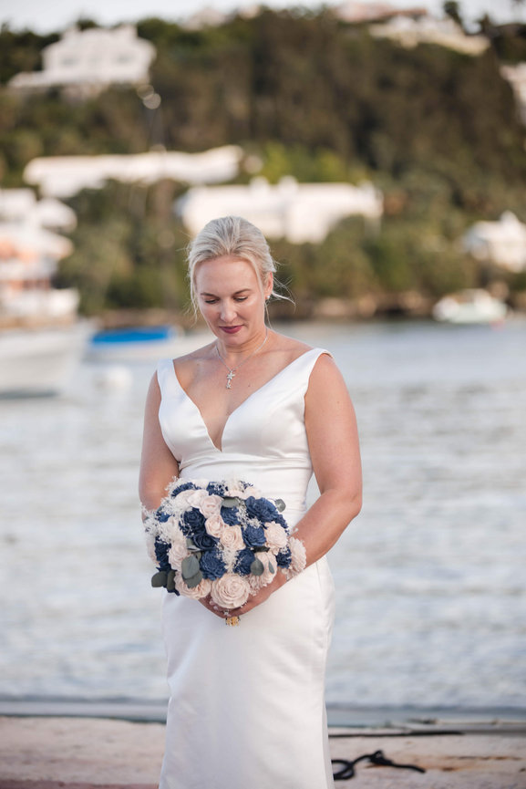 Bespoke documentation of a wedding celebration framed by towering Bermuda Palmettos, highlighting the deep greens and sophisticated tropical light of a private island estate.