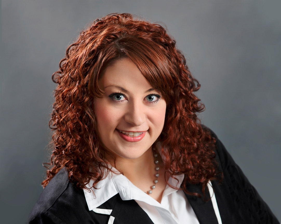 Woman with red hair engaged with the camera