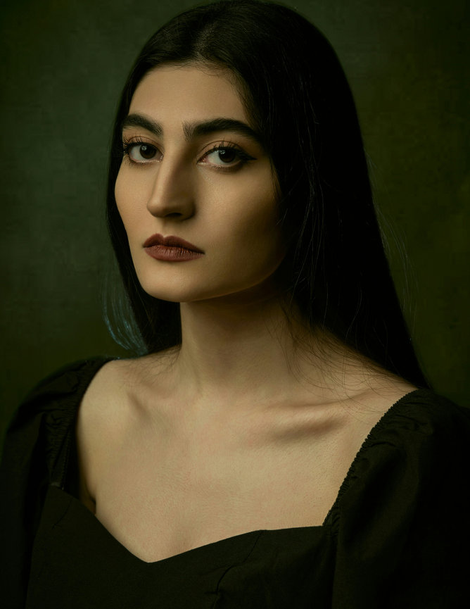 Woman posing in dark outfit