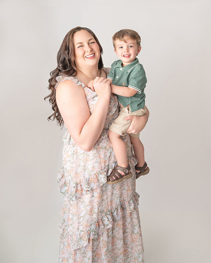 Cranford mother and son posing on modern white backdrop