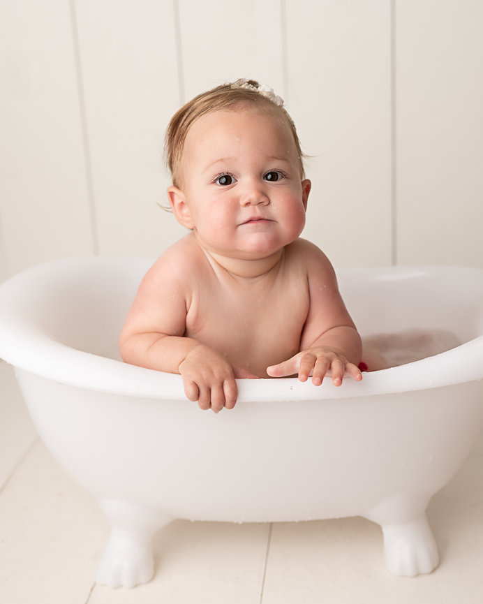 Soft, timeless portrait of baby in clawfoot tub in Shrewsbury, NJ