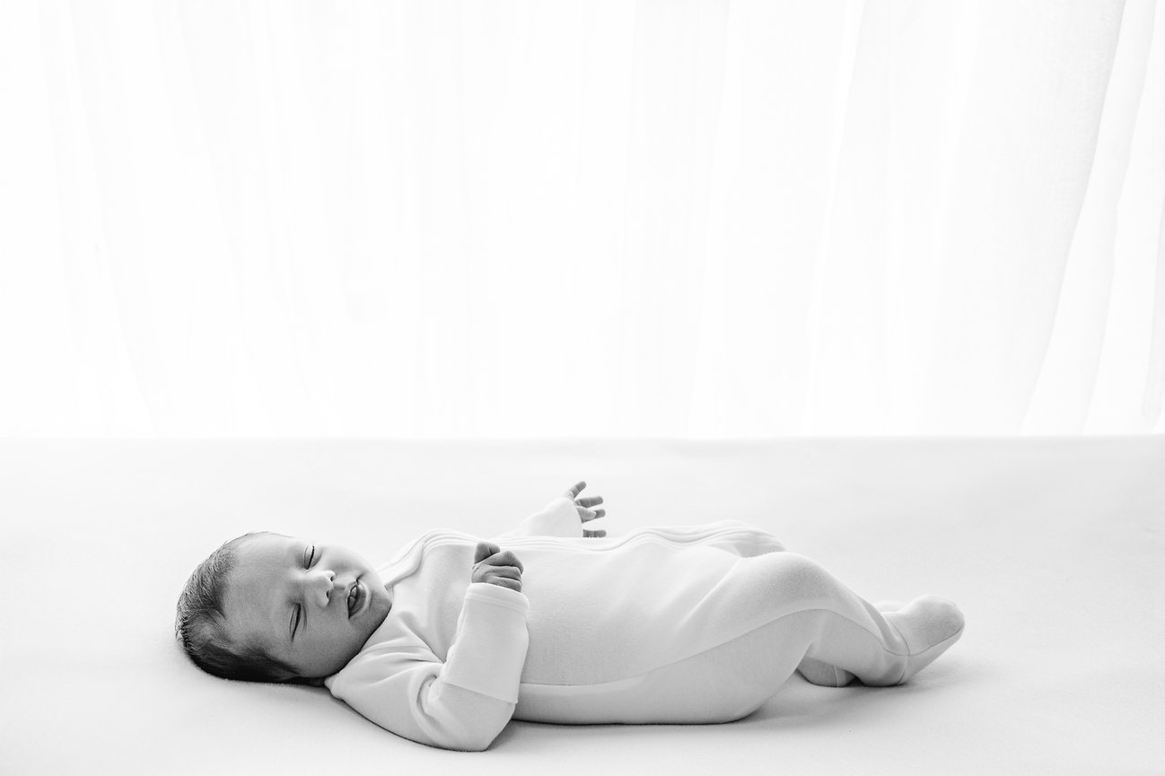 All-white, baby-led session for Monmouth County newborn in natural light