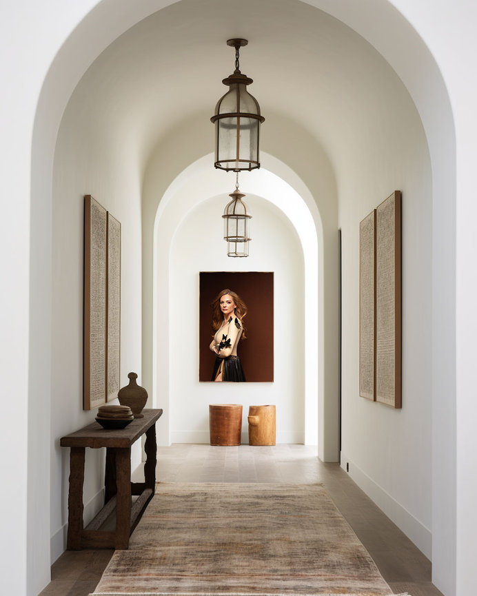 Hallway gallery portrait installation from Braly Studios, offering in-person sales of custom wall art.
