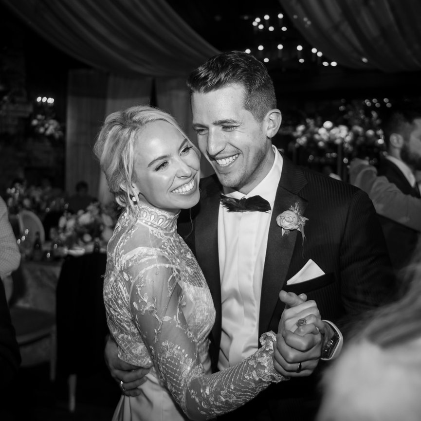 Black and white photo of bride and groom dancing at The Farm at Old Edwards in Highlands, North Carolina. Destination wedding photography by Heather Durham.