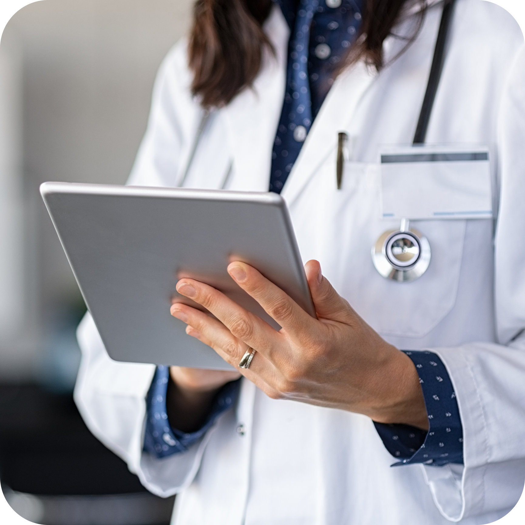 Physician using a tablet as part of a digital medical presence