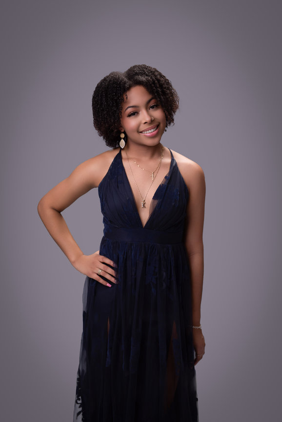 Portrait of a female in a navy dress